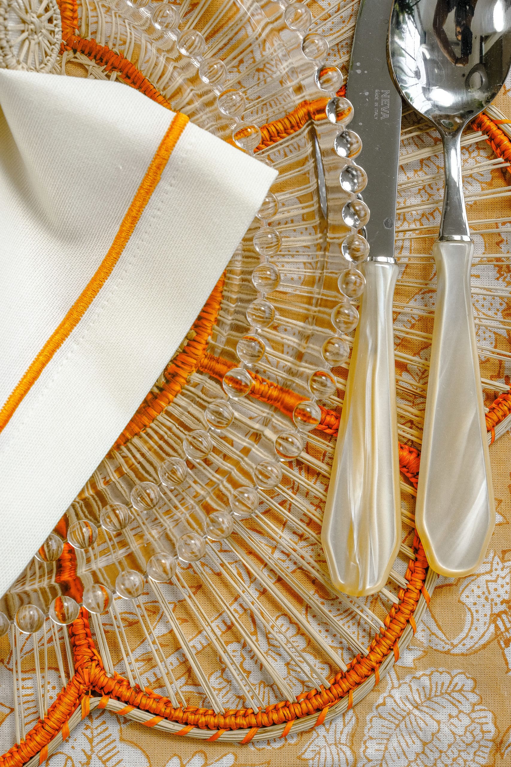 פלייסמט כתום Flora Woven - פיית השולחן